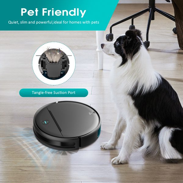 Robot vacuum with a tangle-free suction port next to a dog